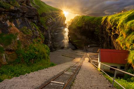 The incline railway operates a narrow-gauge line from the low-level harbour inside the gorge, up a steep incline to the boathouses of the upper village, Gjogv, Eysturoy Island, Faeroe islands, Denmark, Europe